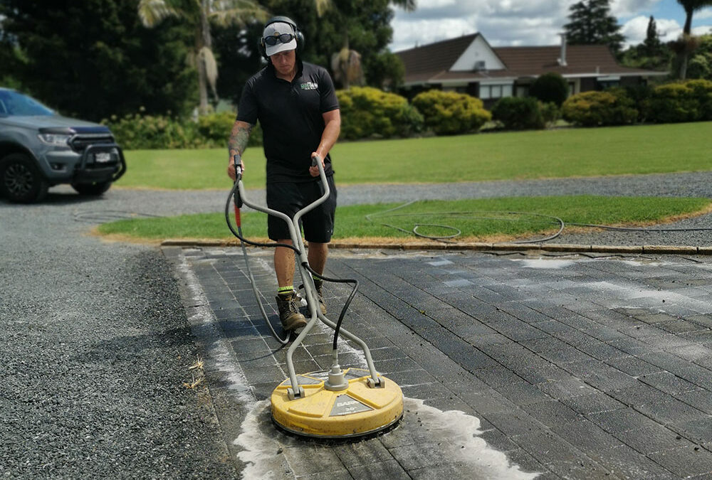 Pressure cleaning concrete driveway