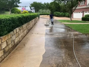 pressure washing a concrete driveway