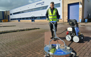 Cleaning a driveway with a pressure washer