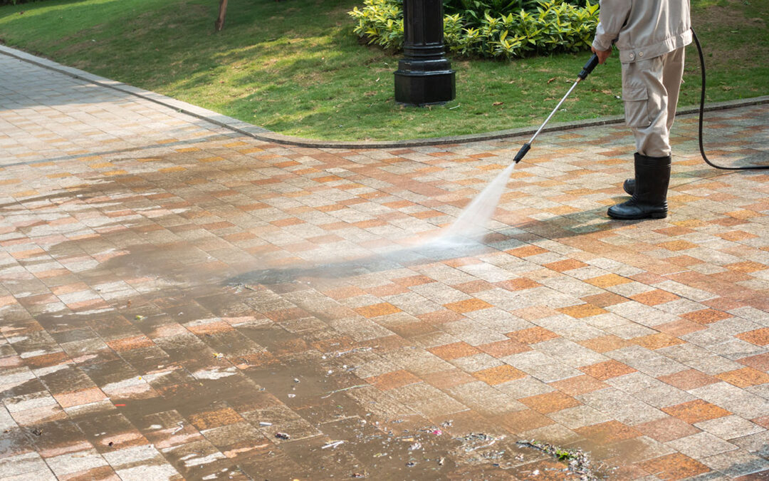 Pressure washing dirty driveway