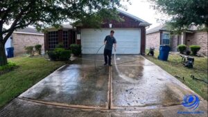 Pressure washing dirty driveway