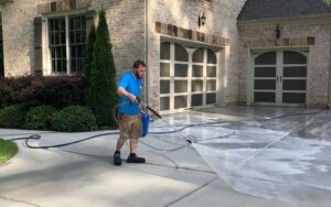 Pressure washing driveway patio